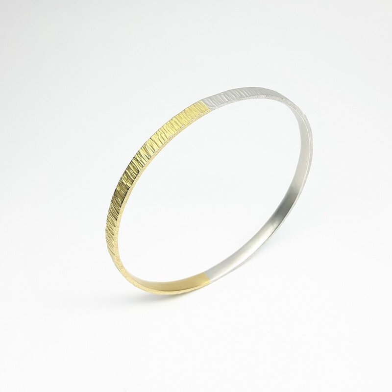 "all-round", bracelet en or jaune 18kt et argent 925/-.
