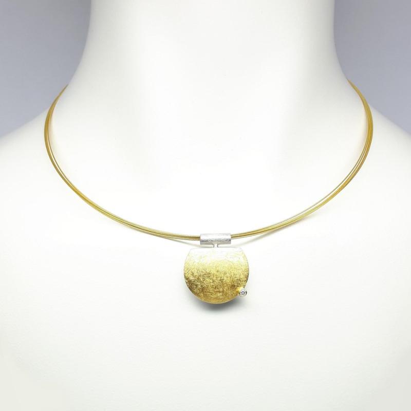 Pendentif en argent 925/-, or fin, or jaune 18kt et diamant.