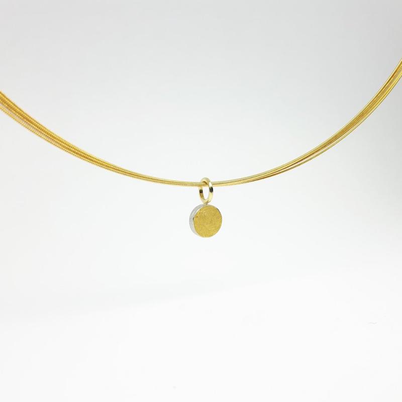 Pendentif en argent 925/-, or fin et or jaune 18kt.