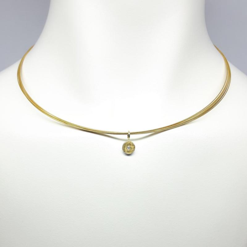 Pendentif en argent 925/-, or fin, or jaune 18kt et diamant.